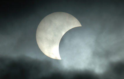 Partial eclipse through clouds
