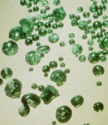 Green glass beads from the Moon