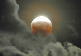 Partial lunar eclipse and clouds