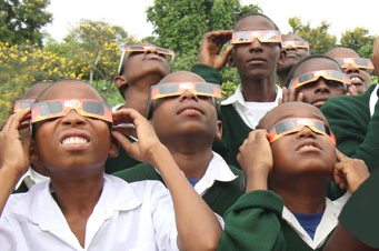 Tanzanian children view the Sun
